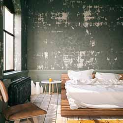 An adult bedroom where a family may bring the baby for sleeping or playing with the parents in the morning.